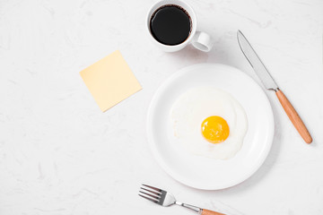 Top view of traditional healthy easy quick breakfast meal made of fried eggs served on a plate.
