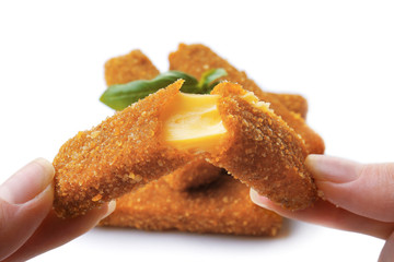 Female hands with cheese stick on white background