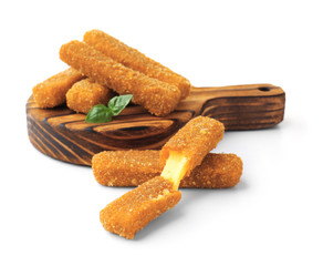 Wooden board with cheese sticks on white background