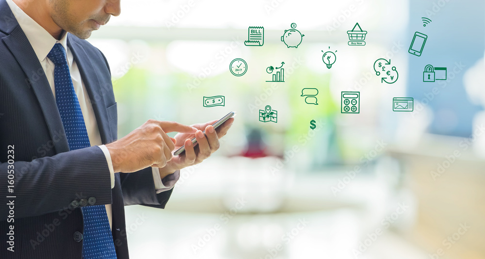 Aufkleber business man wear suit using mobile phone to pay on mobile banking features icon with blur office ba