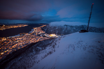 Large panoramic view over Tromso, Norway, at twilight with a cloudy sky