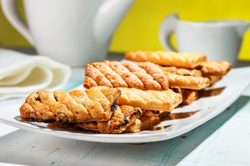 puff cookies with raisins on the plate