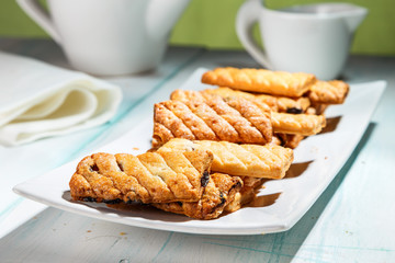 puff cookies with raisins on the plate