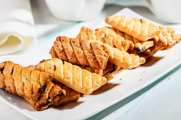 puff cookies with raisins on the plate