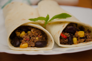 Chili con carne served in tortillas wraps