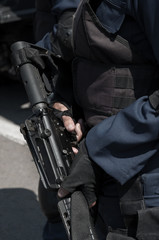 Soldier holding a machine with automatic gun.Preparation for military action.Soldier dressed in protective equipment