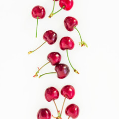 Juicy cherries on white background. Flat lay. Top view. Red berries