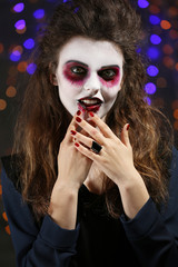 Young woman with Halloween makeup at party