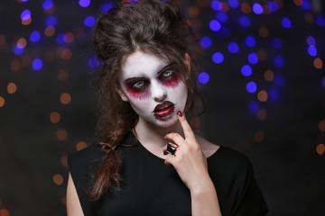 Fototapeta premium Young woman with Halloween makeup at party