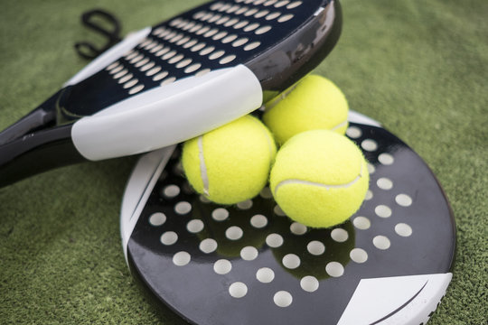Close up image of paddle tennis balls and rackets