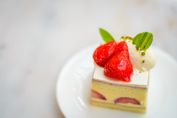 Strawberry Chiffon Entremet cake on white china plate