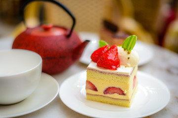 Strawberry Chiffon Entremet cake on white china plate
