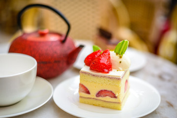 Strawberry Chiffon Entremet cake on white china plate