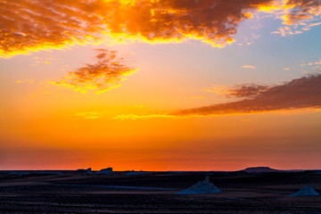 Fototapeta premium The dazzling and colored twilight of the white Desert.