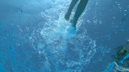 Teenage boy swimming freestyle in swimming pool - Powered by Adobe
