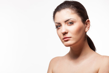 Portrait of woman in harsh studio light. Wet hairs. Studio posing