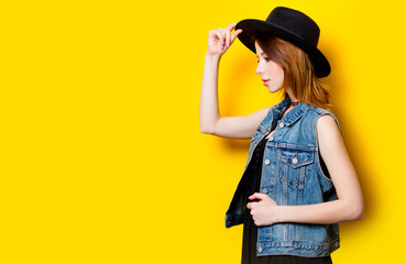 Portrait of young adult woman in hat