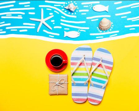 Summertime flip-flops and coffee cup