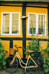 Fototapeta na wymiar bycicle on a brick yellow wall