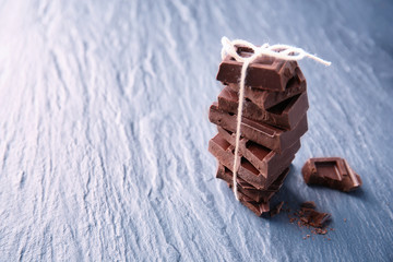 Tied chocolate pieces on table