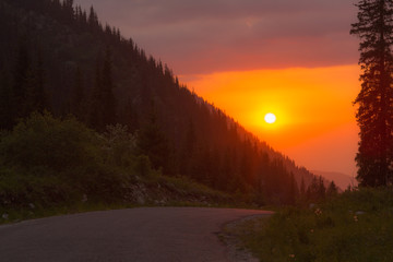 Sunset on the mountainside, orange sky