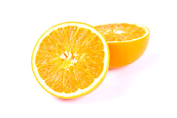 Split oranges on white background
