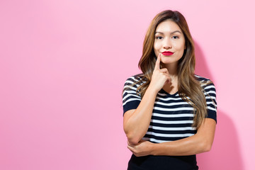 Young woman in a thoughtful pose