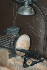 Small lathe for working wood, sawdust and shavings around