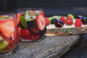 Glasses fruit water with various ingredients