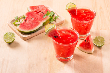 Watermelon drink in glasses with slices of watermelon in summertime