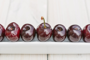 Olive boat filled with cherries