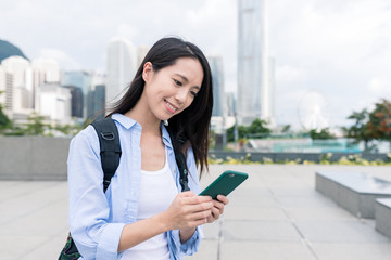 Fototapeta premium Woman use of mobile phone in Hong Kong