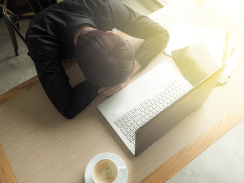 hard work concept, Tired creative editor sleeping on laptop at office