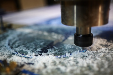 Metallic detail of lathe machine over working surface