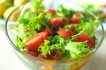 fresh vegetable salad with tomato, cucumber and salad frisee