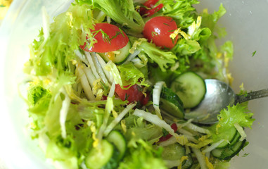 Fresh vegetable salad with tomato, cucumber and salad frisee