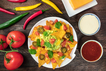 Nachos with cheese, traditional Mexican snack, with ingredients