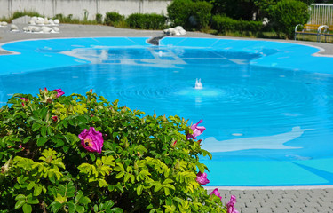 Outdoor pool with water attractions