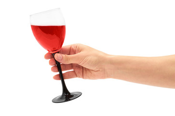 Female hand holds red Wine in glass. Isolated on white background