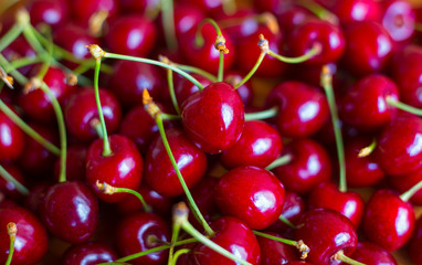Fresh garden cherry on wooden table. Top view with copy space