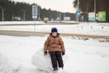 boy walking on a winter street
