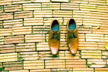 Business Man Brown Shoes Top View on brick background