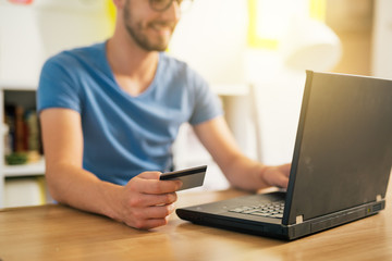 Fototapeta na wymiar online shopping. Man using his credit card for online shopping