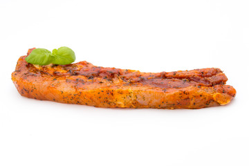Spicy marinated spare ribs barbecued on the white background.
