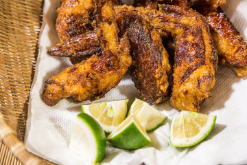 Japanese style fried chicken wing with lime slice