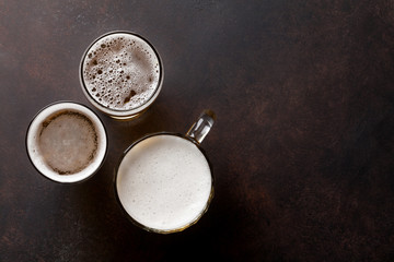 Lager beer mugs on stone table
