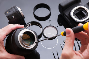 Photo camera lens repair set. Technician engineer check optics alignment and maintenance support of...