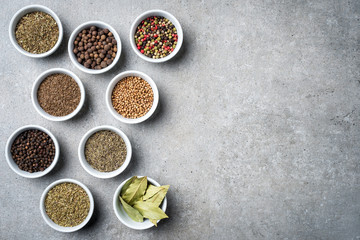 Herbs and spices in white bowls. Top view