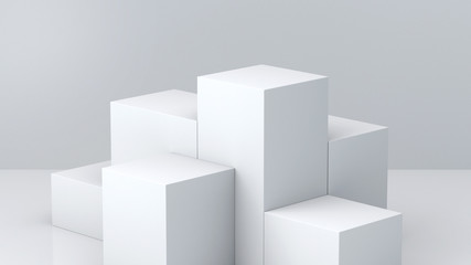 White cube boxes with white blank wall background for display. 3D rendering.
