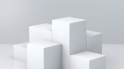 White cube boxes with white blank wall background for display. 3D rendering.
